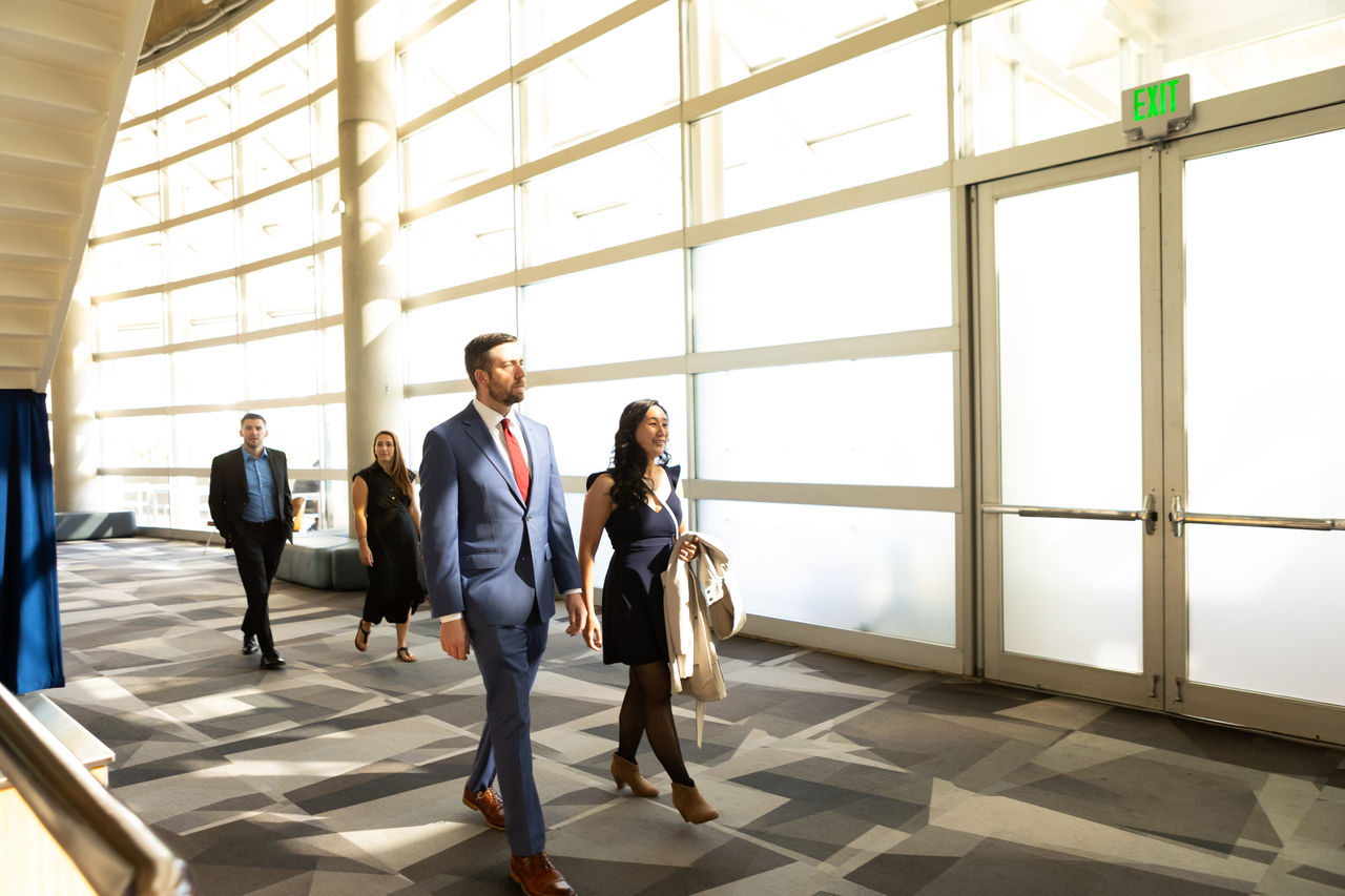 Business professionals walking in modern atrium