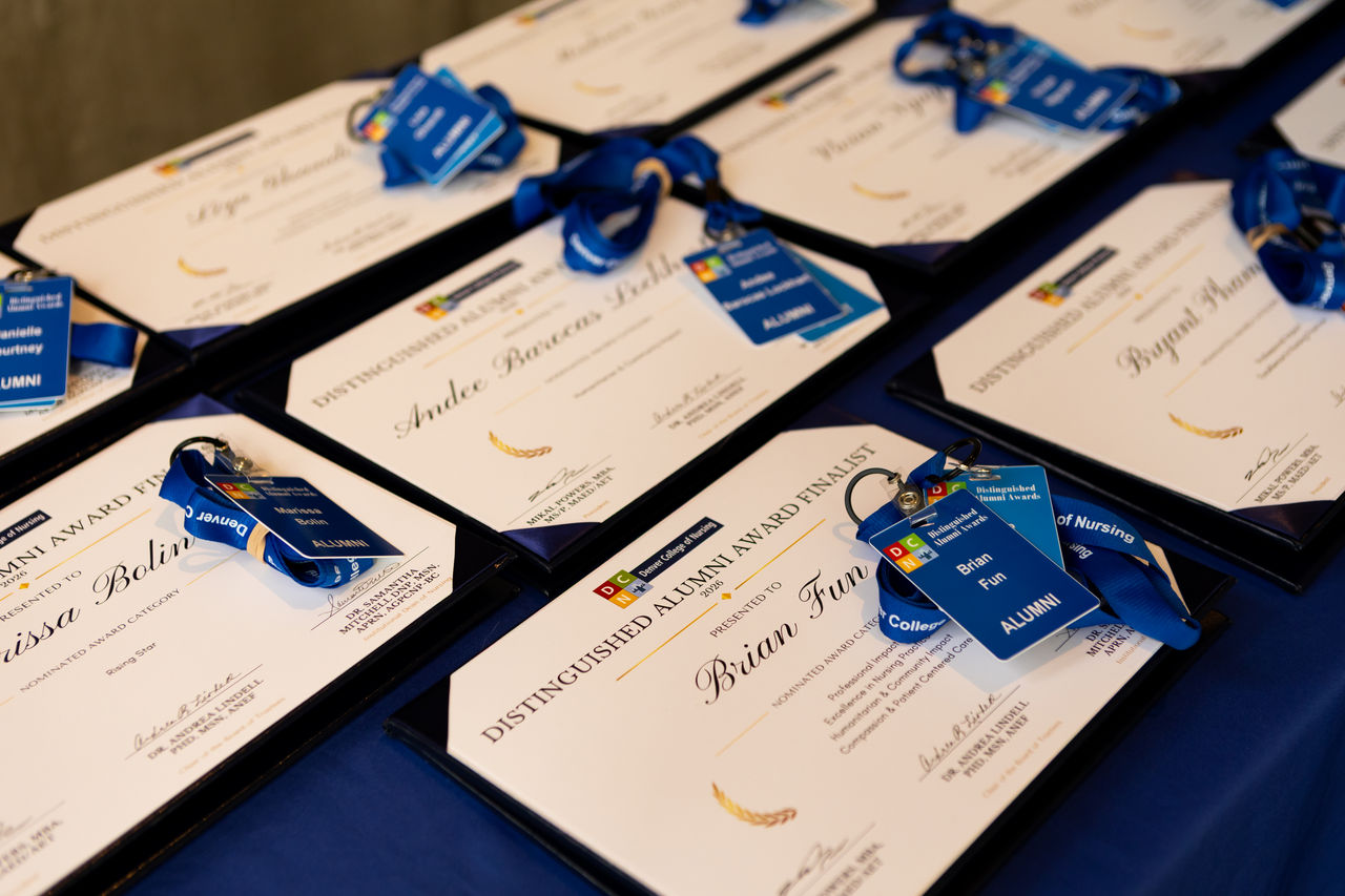 Distinguished Alumni Award Certificates on Display Table
