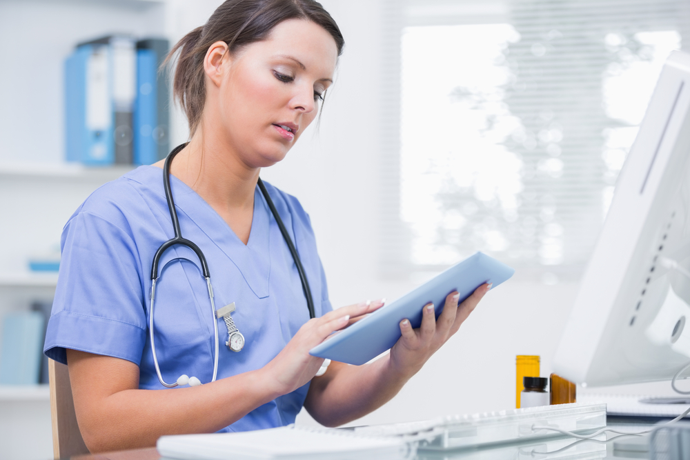 Healthcare professional using digital tablet